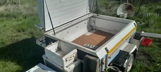 Trailer with tent and side storage