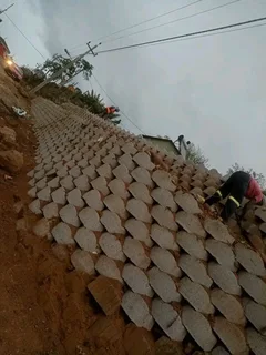 G BLOCKS RETAINING AND TAR ROAD INSTALLATION