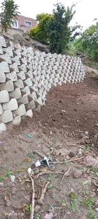 G Blocks Retaining And Tar Road Installation