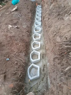 G BLOCKS RETAINING AND TAR ROAD INSTALLATION