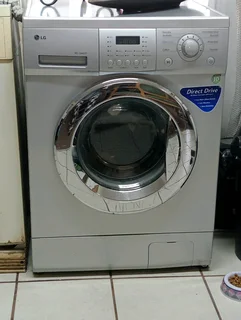 Silver LG Front loader washing machine washing machine. Almost new!