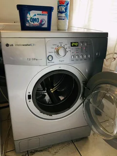 SILVER LG DIRECT DRIVE FRONT LOADER WASHER AND DRYER COMBO MACHINE