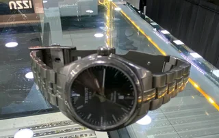 Titanium Tisso watch and a pure gold Tisso watch