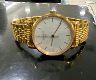 Titanium Tisso watch and a pure gold Tisso watch