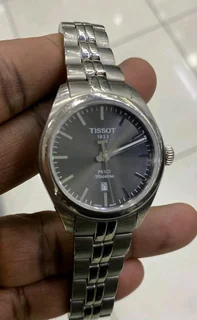 Titanium Tisso watch and a pure gold Tisso watch