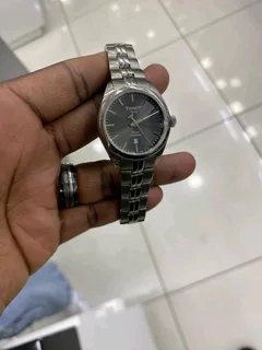 Titanium Tisso watch and a pure gold Tisso watch