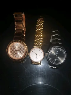 Titanium Tisso watch and a pure gold Tisso watch