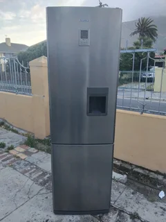 Metallic samsung water dispencer fridge freezer
