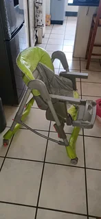 Adjustable, foldable Eating Chair in perfect condition, water proof easy to clean seat cover. Chair