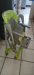 Adjustable, foldable Eating Chair in perfect condition, water proof easy to clean seat cover. Chair