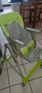 Adjustable, foldable Eating Chair in perfect condition, water proof easy to clean seat cover. Chair