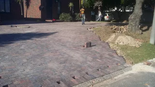 Paving And Roll On Lawn Installation