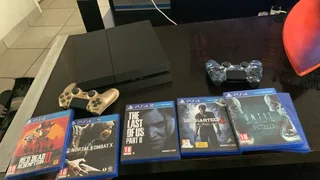 Playstation 4 with games, wire and controller