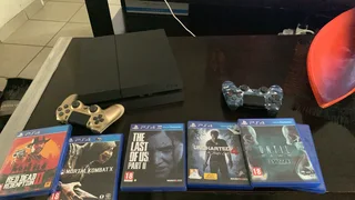 Playstation 4 with games, wire and controller