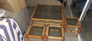 Bamboo coffee table and 3 matchingdide tables , each with a glass