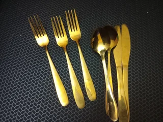 Full decor set up with gold cutlery and crockery decor. All events decor and party equipment hire.