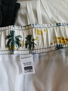 Gents shorts long length white elasticated at the waist one cream with draw string Rneg