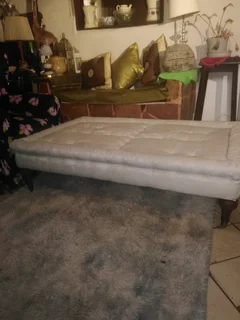 Resting couch with brass wheels