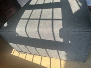 Grey material large ottoman