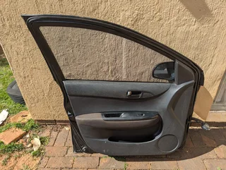 Complete Hyundai i20 2012 model left side front door available for sale.