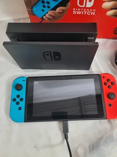 Nintendo Switch console in the Neon Red and Neon Blue variant.