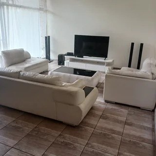 Leather couches, coffee table and tv stand