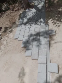 Natural grass and cobbles paving