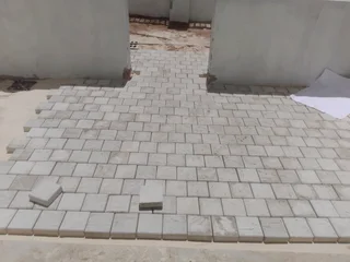 Natural grass and cobbles paving