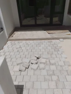 Natural grass and cobbles paving