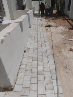 Natural grass and cobbles paving