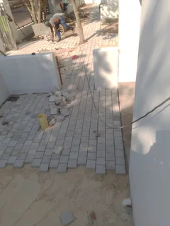 Natural grass and cobbles paving