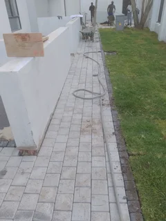 Natural grass and cobbles paving