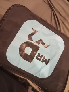 Mr D carrying bag