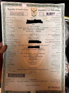 2015 Audi A3 Sportback Registration paper and VIN tag pieces.