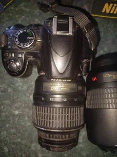 Nikon D3200 DSLR camera with extra lens, battery charger, etc.