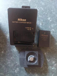 Nikon D3200 DSLR camera with extra lens, battery charger, etc.
