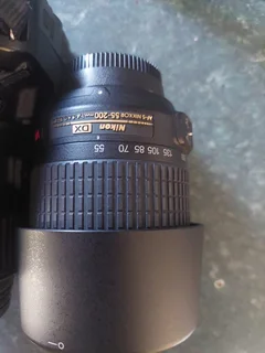 Nikon D3200 DSLR camera with extra lens, battery charger, etc.