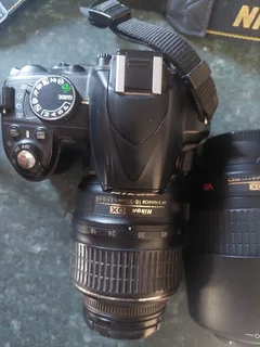 Nikon D3200 DSLR camera with extra lens, battery charger, etc.