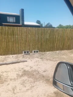 Bamboo fencing and wooden pannels.
