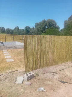 Bamboo fencing and wooden pannels.