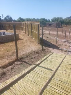 Bamboo fencing and wooden pannels.