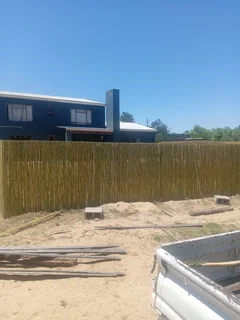Bamboo fencing and wooden pannels.