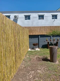Bamboo fencing and wooden pannels.