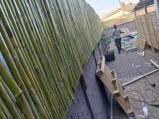 Bamboo fencing and wooden pannels.
