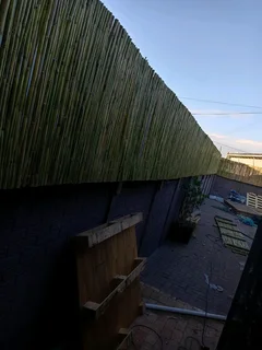 Bamboo fencing and wooden pannels.