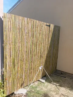 Bamboo fencing and wooden pannels.