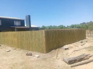 Bamboo fencing and wooden pannels.