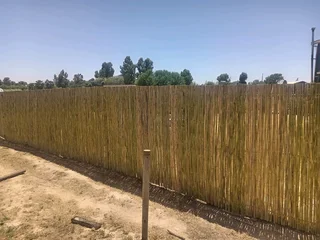 Bamboo fencing and wooden pannels.