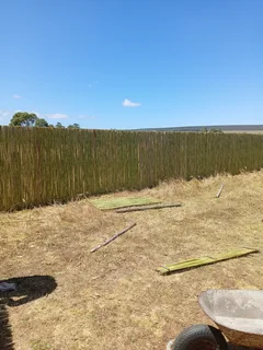 Bamboo fencing and wooden pannels.