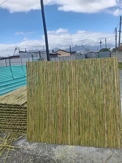Bamboo fencing and wooden pannels.